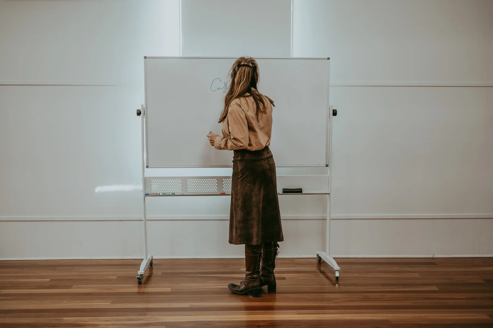 Edwina at the whiteboard during a corporate workshop session